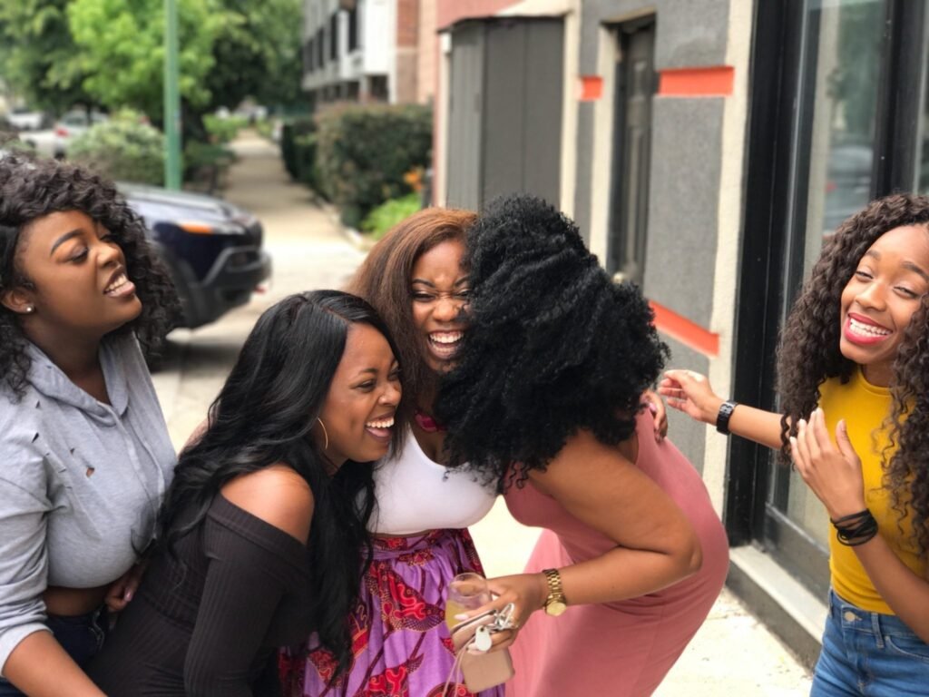 Close Black American couple sharing the profound power of laughter with their friend