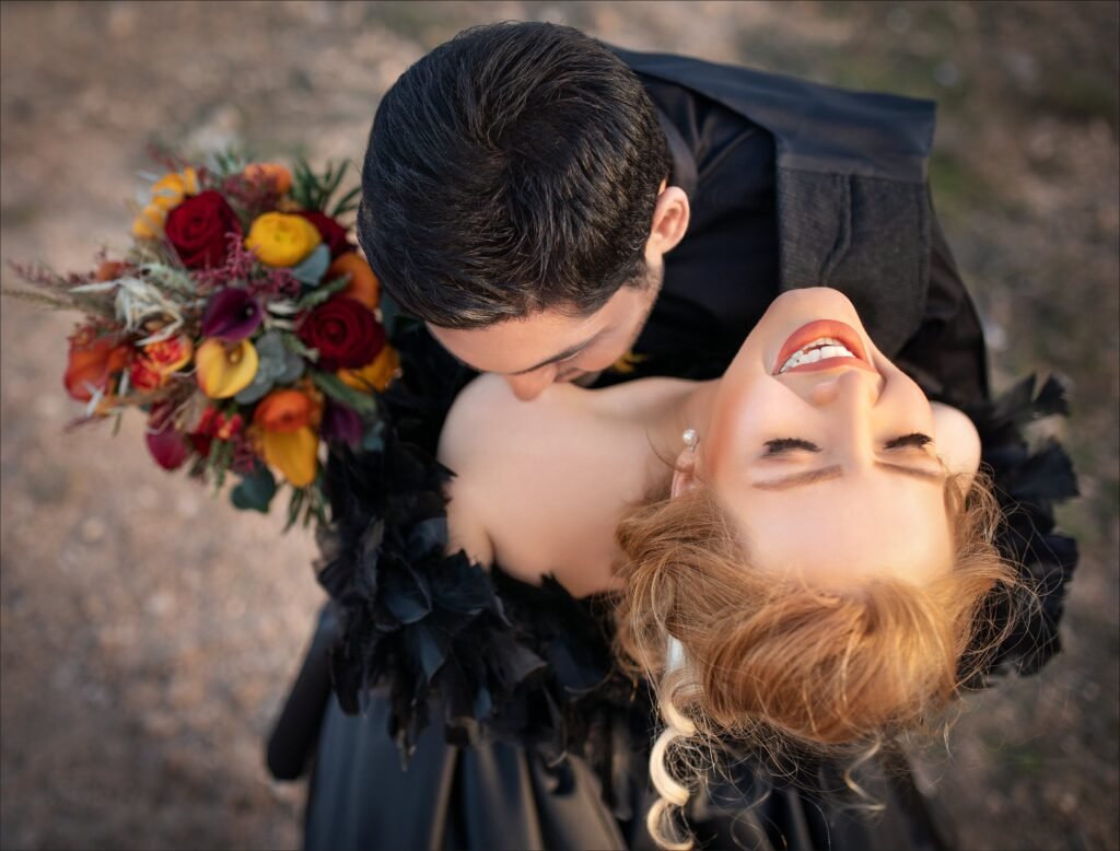 A newly wed couple kissing and happy