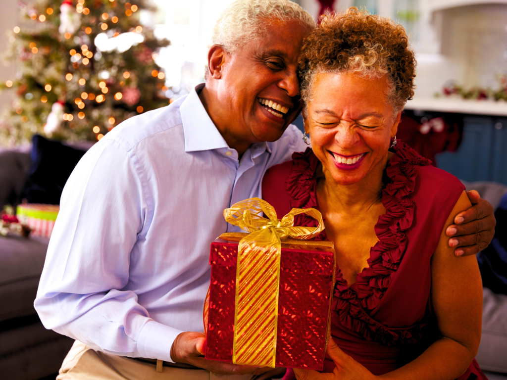 A Black couple celebrating their 40th wedding anniversary speaking their gift giving love language.