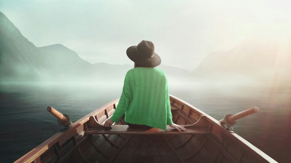 a lady riding a boat in a self-discovery journey during her birthday
